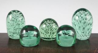 Five glass dump weights, late 19th century, two internally decorated with flowers, the three