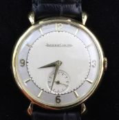 A gentleman's 1950's 18ct gold Jaeger LeCoultre manual wind wrist watch, with baton and quarterly