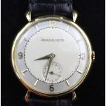 A gentleman's 1950's 18ct gold Jaeger LeCoultre manual wind wrist watch, with baton and quarterly