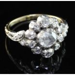 An antique style gold and silver, diamond cluster ring, set with rose cut stones, the central