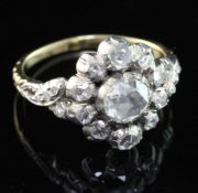 An antique style gold and silver, diamond cluster ring, set with rose cut stones, the central