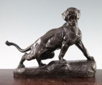 Thomas Cartier (French, 1879-1943). A patinated bronze model of a lion, 'Lionne Rugissant', on a