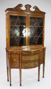 An Edwardian Sheraton Revival marquetry inlaid side cabinet, with shaped front, on six legs, W.
