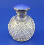 A George V silver and guilloche enamel lidded hobnail cut glass scent bottle, of globular form,