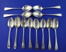 A set of nine George III silver Old English pattern dessert spoons by William Bateman, with engraved