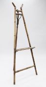 A late 19th century bamboo easel, with tapering A frame, H.5ft 6ins.