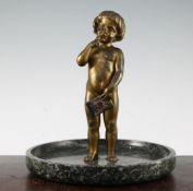 An early 20th century patinated bronze of a small child standing holding a letter, on a wide