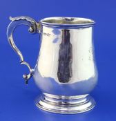 An early Victorian silver baluster mug, with engraved monogram and acanthus leaf capped handle, John