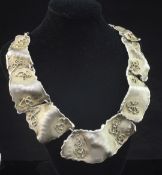 A 1980's? stylish silver gilt necklace, modelled as seven graduated free form links with samorodok