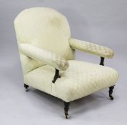 A Victorian open armchair, numbered on foot 19755/8499, fitted Cope Collinson patent castors,