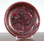 A Moorcroft Leaf and Berry pattern flambe dish, 1945-49, covered with a deep cherry red glaze,