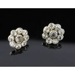 A pair of late 19th/early 20th century gold and silver rose cut diamond cluster earrings, each set