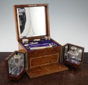 A George V burr walnut and ivory strung toilet box, with monogrammed plaque and mirrored fitted