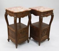 A pair of French carved oak bedside cabinets, each with a single drawer and cupboard door, W.1ft