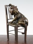 Juan Clara (Spanish 1875-1957). A bronze figure of a young girl climbing onto a chair, signed, 8.
