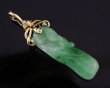 An 18ct gold mounted and diamond set jadeite pendant, carved as a melon,