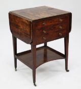A George III mahogany and rosewood crossbanded Pembroke work table, fitted with two drawers above