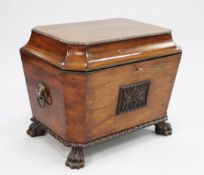 A Regency carved mahogany sarcophagus shape wine cooler, the front with central acanthus carved