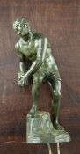 A Titze Austrian 20th century, Steinwerfer, patinated bronze of a nude male, holding a rock,