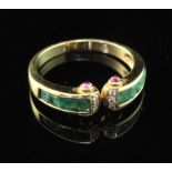 A stylish 18ct gold, emerald and diamond ring, with cabochon ruby set terminals, size O.