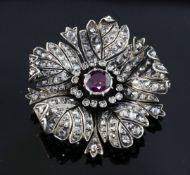 A late 19th/early 20th century French 18ct gold and silver, garnet and rose cut diamond set