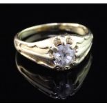 An early 20th century 18ct gold and claw set solitaire diamond ring, the old cut stone weighing