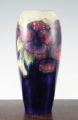 Two William Moorcroft pansy pattern vases, c.1917, the first of tall ovoid form, the second of