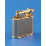 A late 1920's engine turned 9ct gold Dunhill Unique petrol lighter, 1.75in.