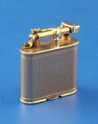 A late 1920's engine turned 9ct gold Dunhill Unique petrol lighter, 1.75in.