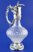 A modern Rococco style sterling silver mounted glass claret jug, of baluster form, with foliate