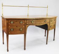 A George III inlaid mahogany and satinwood crossbanded bowfront sideboard, inlaid with marquetry
