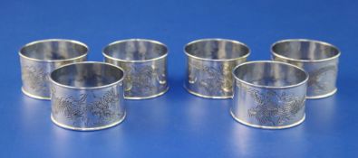 A set of six Chinese? silver napkin rings, each engraved with a dragon, unmarked, 3.5 oz.