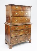 An 18th century walnut chest on chest, fitted with two short and two long drawers above three