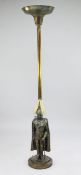 A 1930's brass standard lamp, by Banksway, modelled as an uplighter, mounted with a figure of a