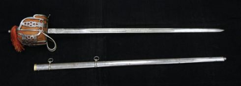An early 20th century Scottish basket hilt broad sword, with 32 inch etched blade and steel