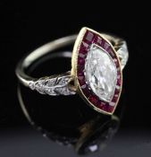 An attractive mid 20th century? gold, ruby and diamond ring, the central marquise cut diamond