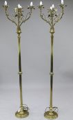 A pair of ecclesiastical gothic style floor lamps, each with four scrolling lights mounted with