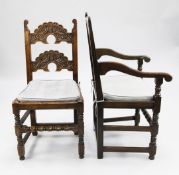 A set of eight 17th century style South Yorkshire carved oak dining chairs, the twin crescent shaped