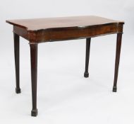 A George III mahogany serpentine shape side table, with single frieze drawer and gothic arch moulded