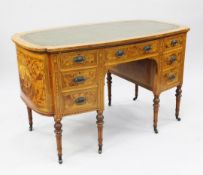 A late Victorian oval satinwood and marquetry inlaid writing desk, by Maple & Co, the shaped top