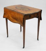 A George III mahogany and rosewood crossbanded butterfly wing Pembroke table, the top with large