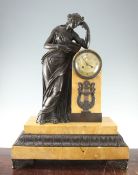 A 19th century French bronze mounted Sienna marble mantel clock, modelled with a figure of a