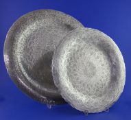 Two mid 20th century Egyptian silver shallow dishes, with similar engraved decoration and wavy rims,