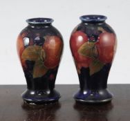 A pair of William Moorcroft miniature pomegranate baluster vases, c.1920, impressed mark Moorcroft