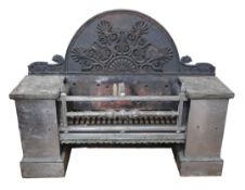 A large Regency polished steel and cast iron fire grate, the arched back with applied Anthemion