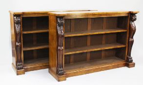 A pair of pollard oak inverted breakfront open bookcases, each with two adjustable shelves between