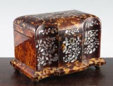 A 19th century tortoiseshell two division tea caddy, the shaped front with floral, leaf and berry