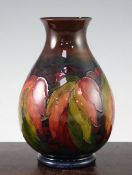 A Moorcroft leaf and berry flambe baluster vase, c.1945-49 impressed script mark W Moorcroft