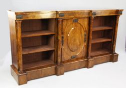 A Victorian walnut and bronze mounted bookcase, the central cupboard door with raised oval panel