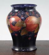 Two William Moorcroft pomegranate pattern vases, c.1916-25, the first of baluster form, impressed